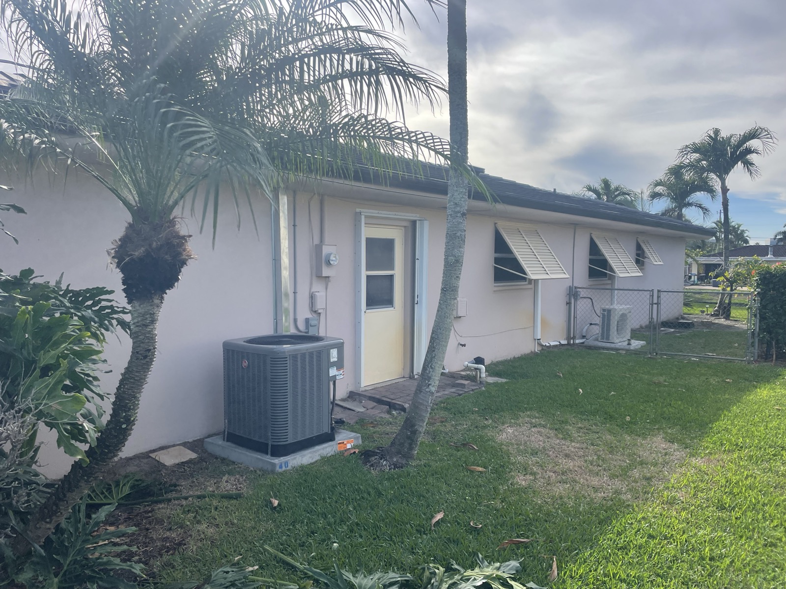 Cream home exterior before repaint
