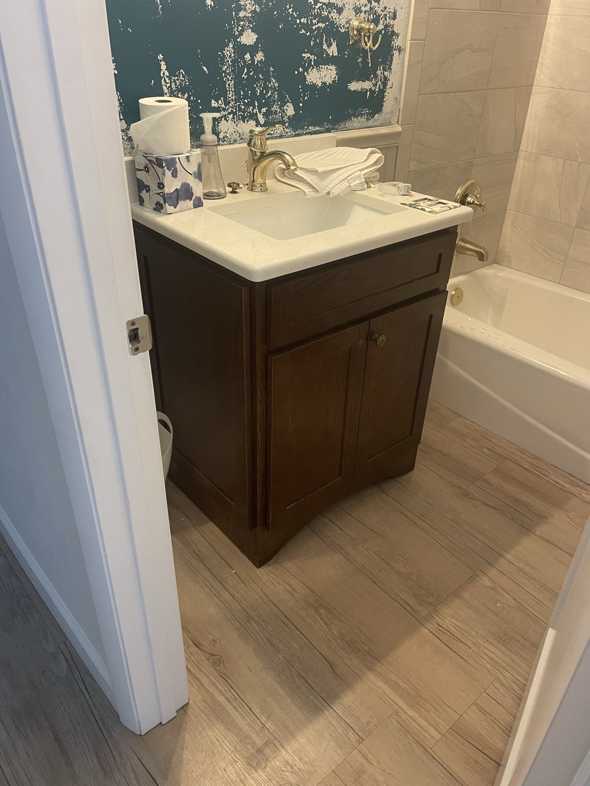 Bathroom with dark wood vanity before repaint