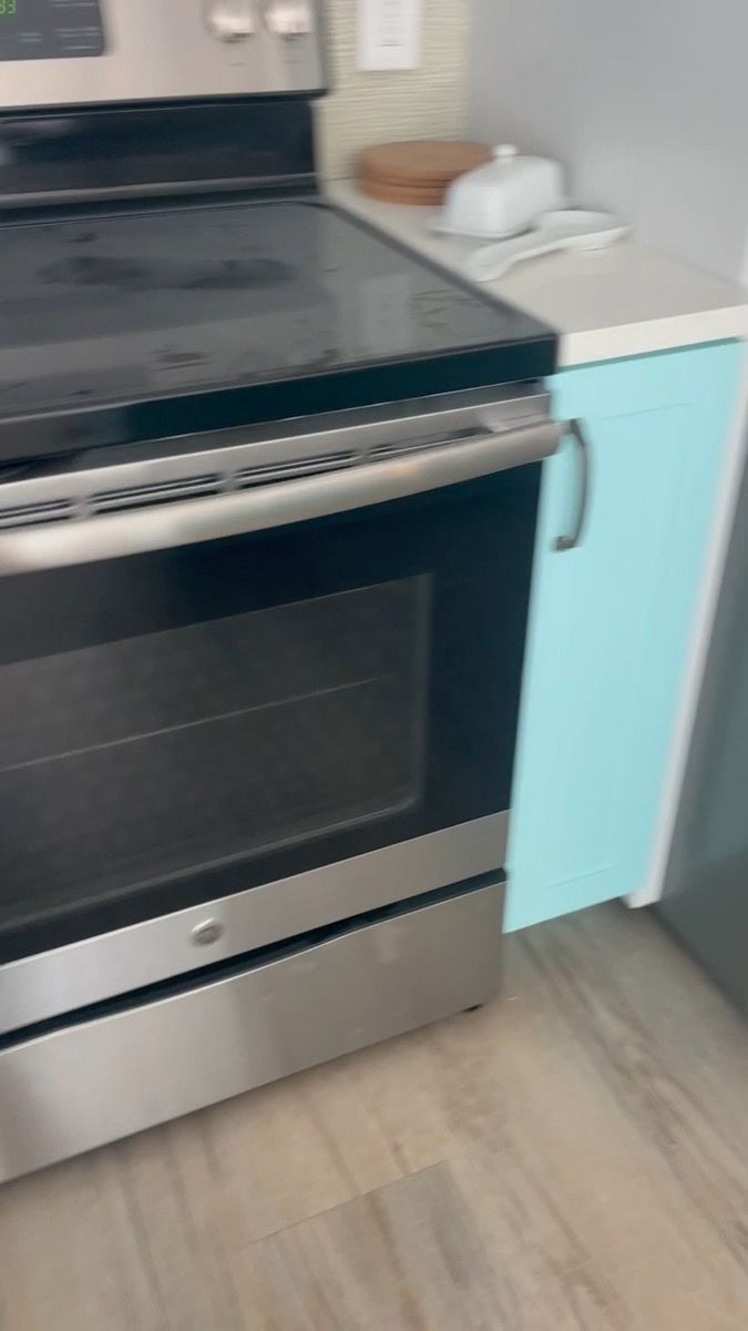 Kitchen with teal cabinetry — video