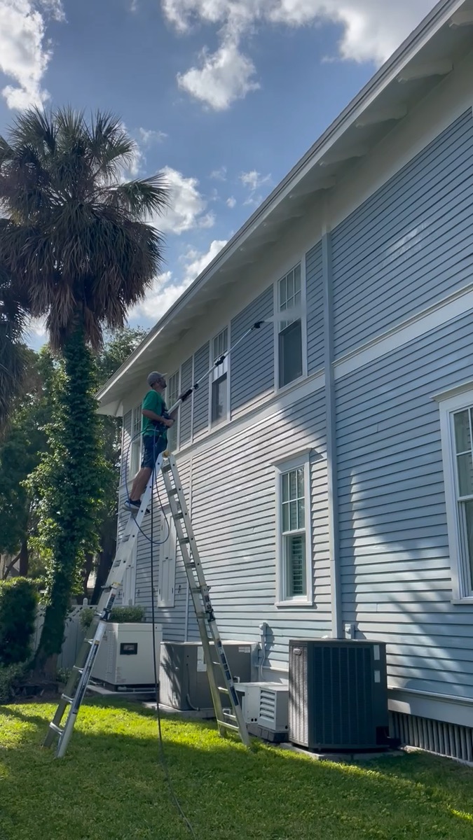 Power washing the exterior siding of a home — video