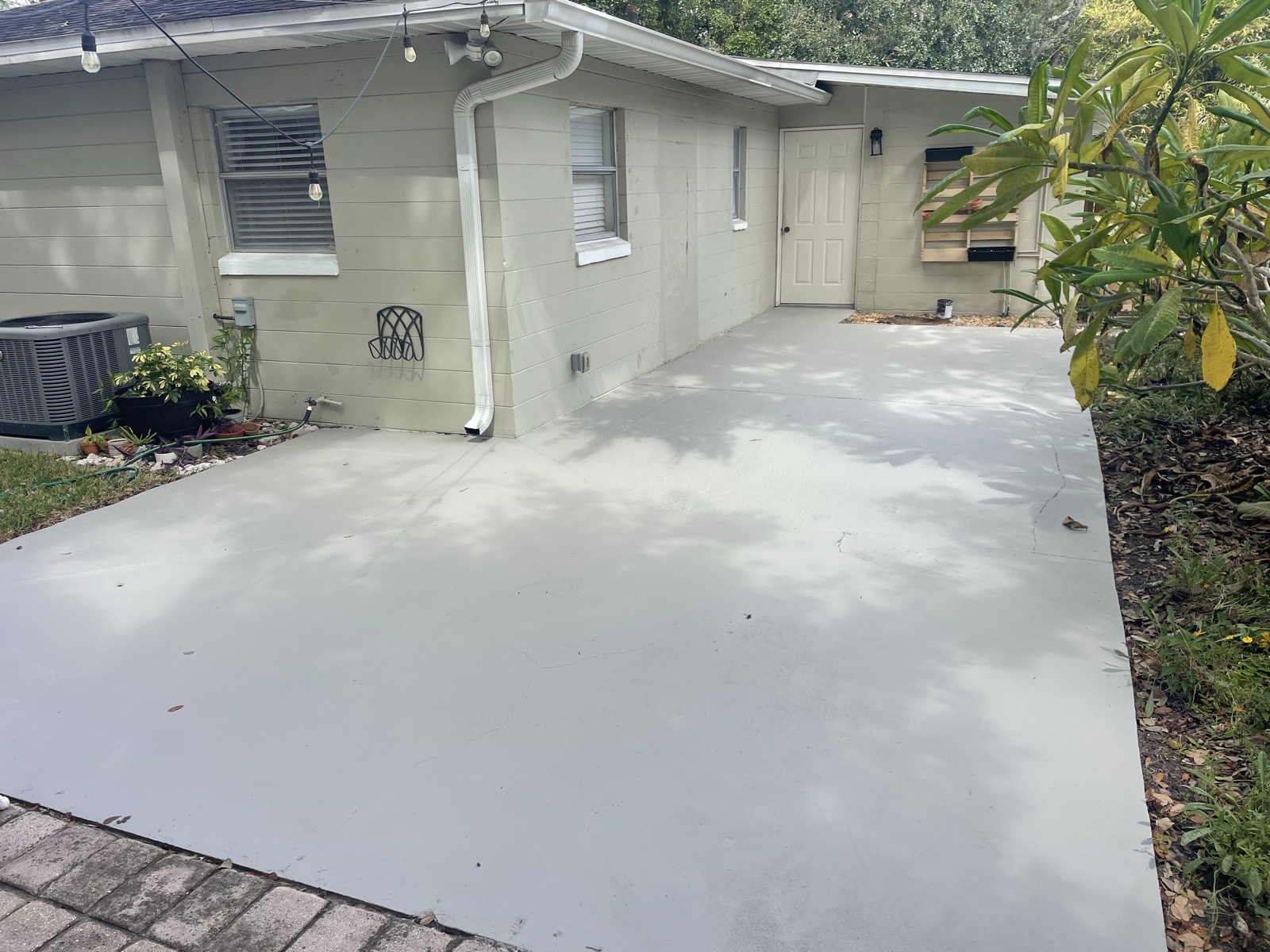 Freshly painted concrete driveway and patio
