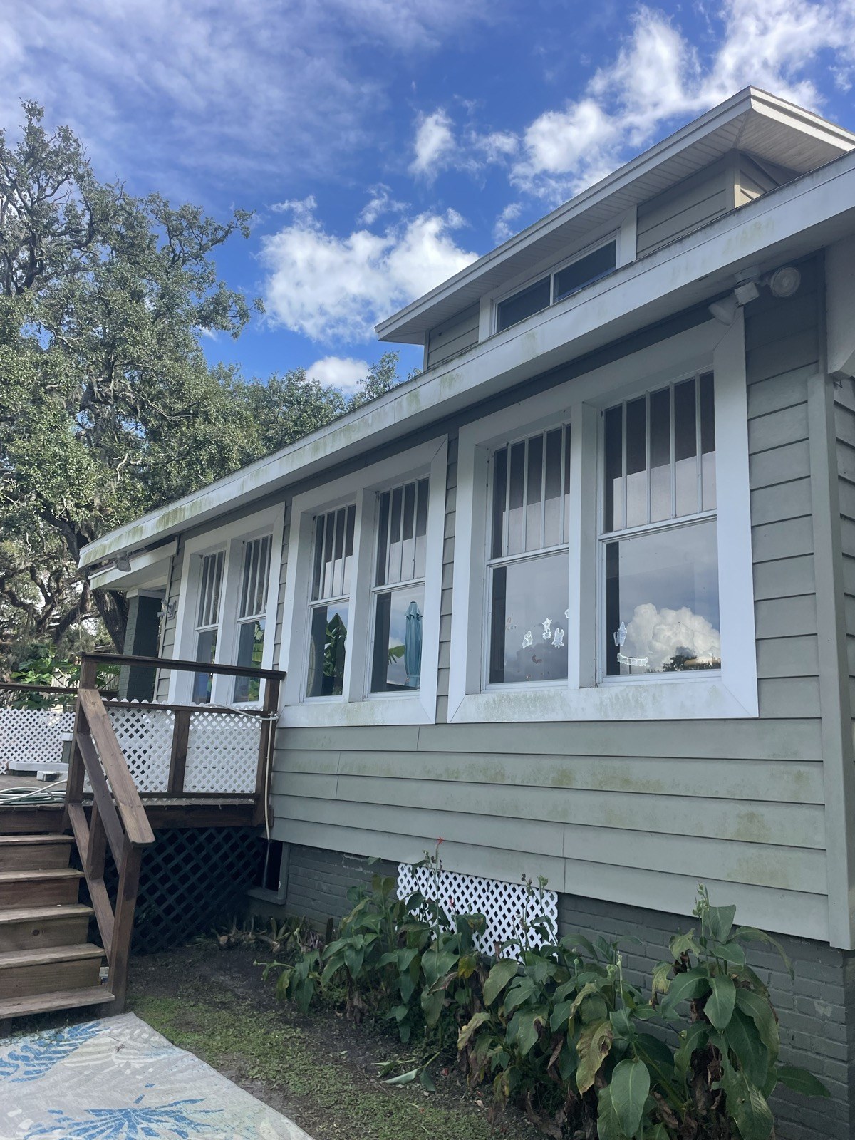 Sage home exterior before power washing